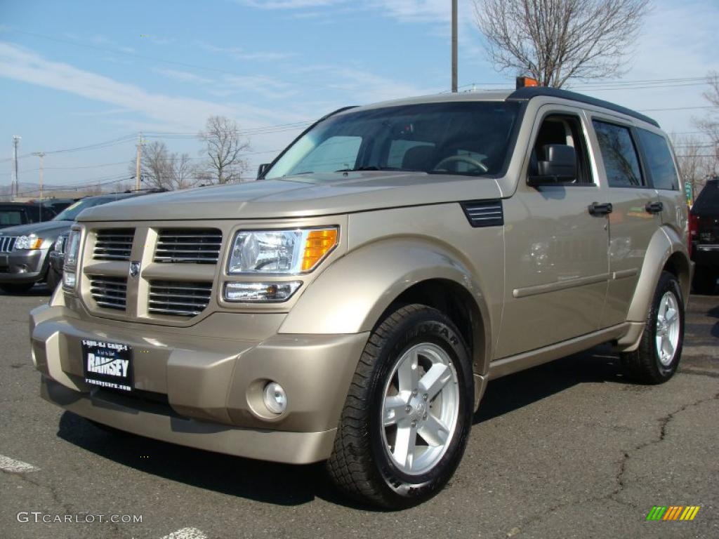 Light Sandstone Metallic 2010 Dodge Nitro SXT 4x4 Exterior Photo #45761699