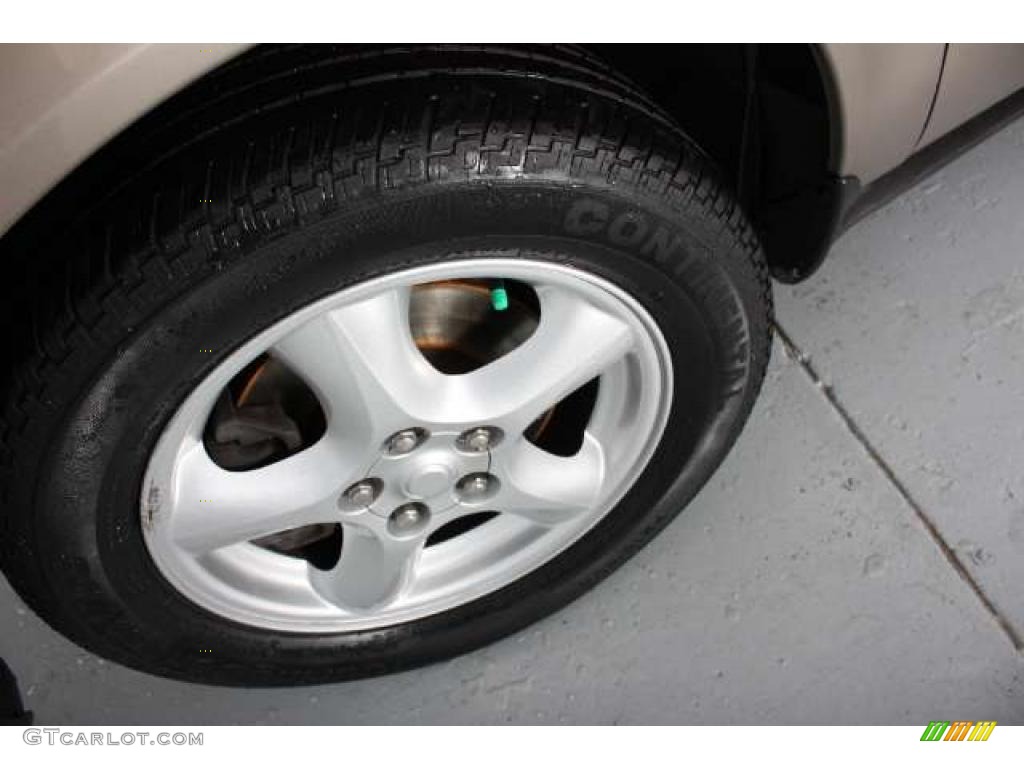 2003 Ford Taurus SES Wheel Photo #45777768