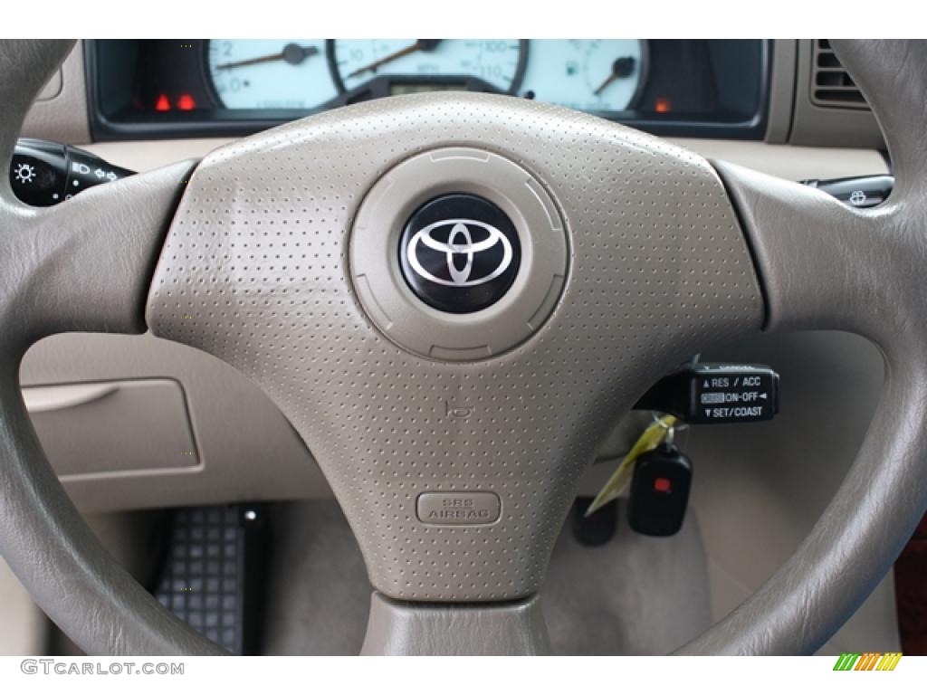 2004 Toyota Corolla LE Pebble Beige Steering Wheel Photo #45797083