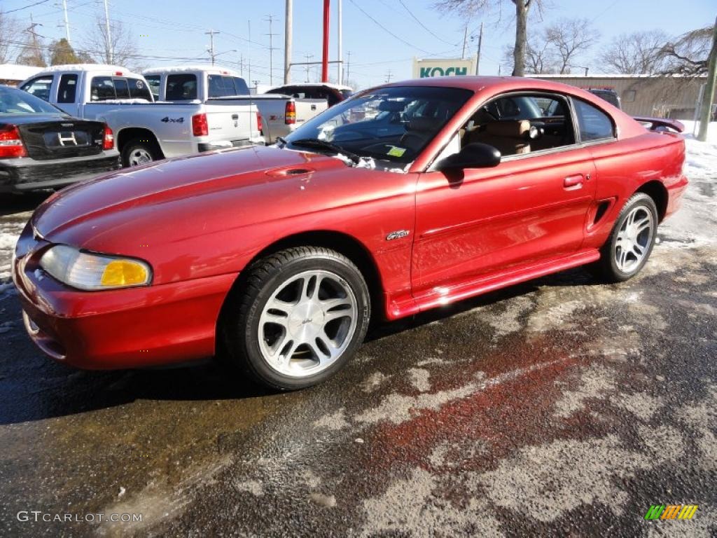 Laser Red Metallic 1997 Ford Mustang GT Coupe Exterior Photo #45885992