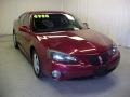 2005 Sport Red Metallic Pontiac Grand Prix Sedan  photo #1