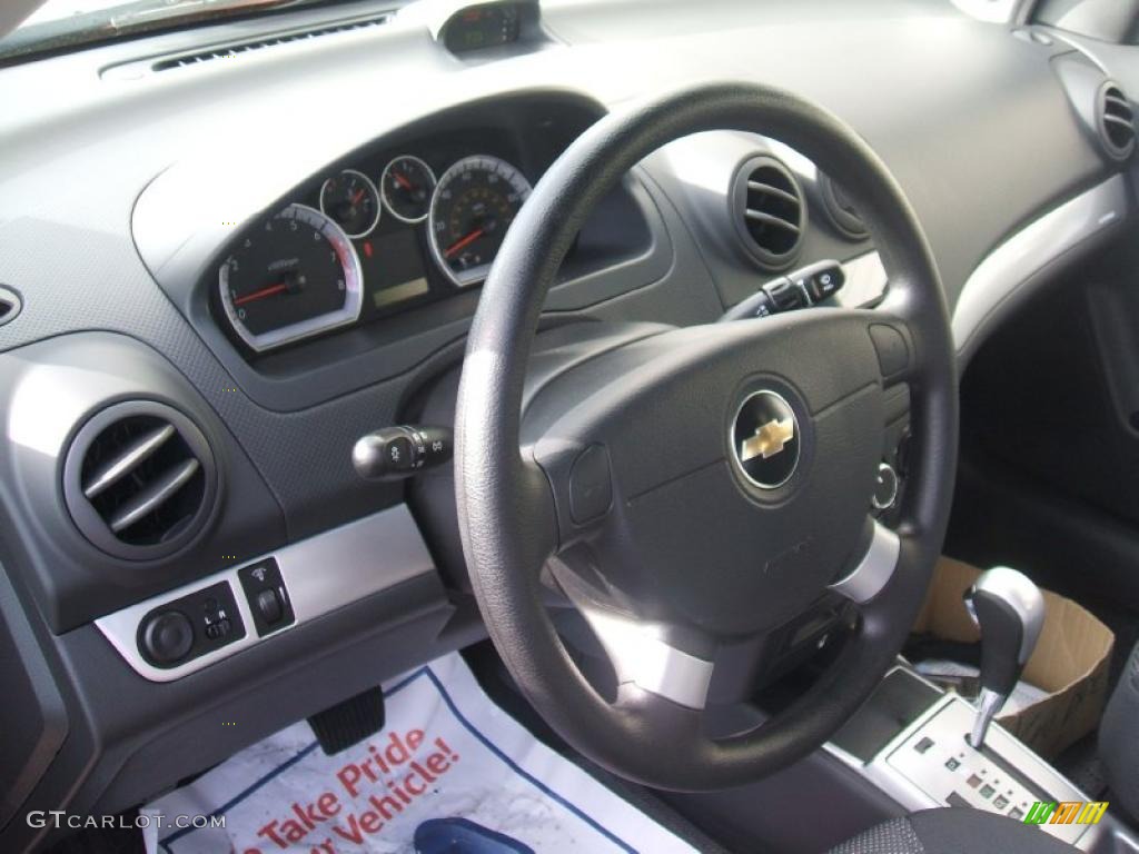2011 Chevrolet Aveo LT Sedan Charcoal Steering Wheel Photo #46103687