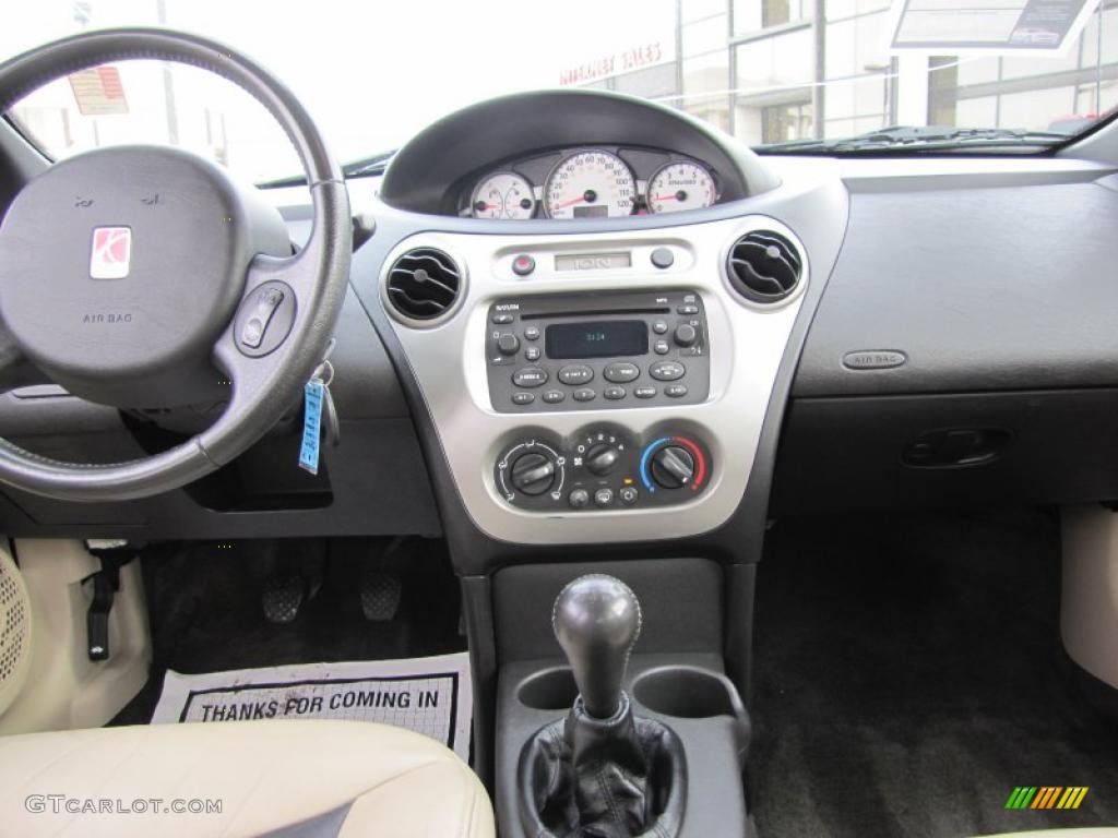 2004 Saturn ION 3 Sedan Tan Dashboard Photo #46117610