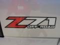 2005 GMC Sierra 1500 SLE Extended Cab 4x4 Badge and Logo Photo