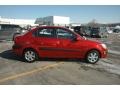 Tropical Red - Rio LX Sedan Photo No. 13