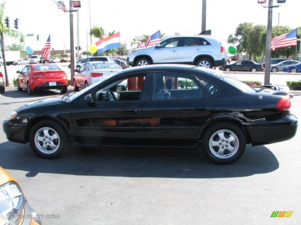 2004 Taurus SE Sedan - Black / Medium Graphite photo #6