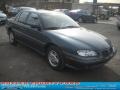 1998 Medium Green-Blue Metallic Pontiac Grand Am SE Sedan  photo #20