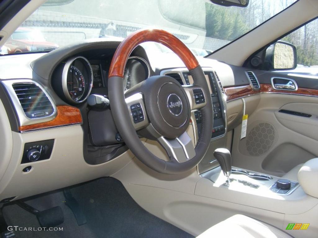 2011 Jeep Grand Cherokee Overland 4x4 Dark Frost Beige/Light Frost Beige Steering Wheel Photo #46248400