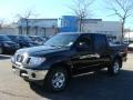 2009 Super Black Nissan Frontier SE Crew Cab 4x4  photo #1