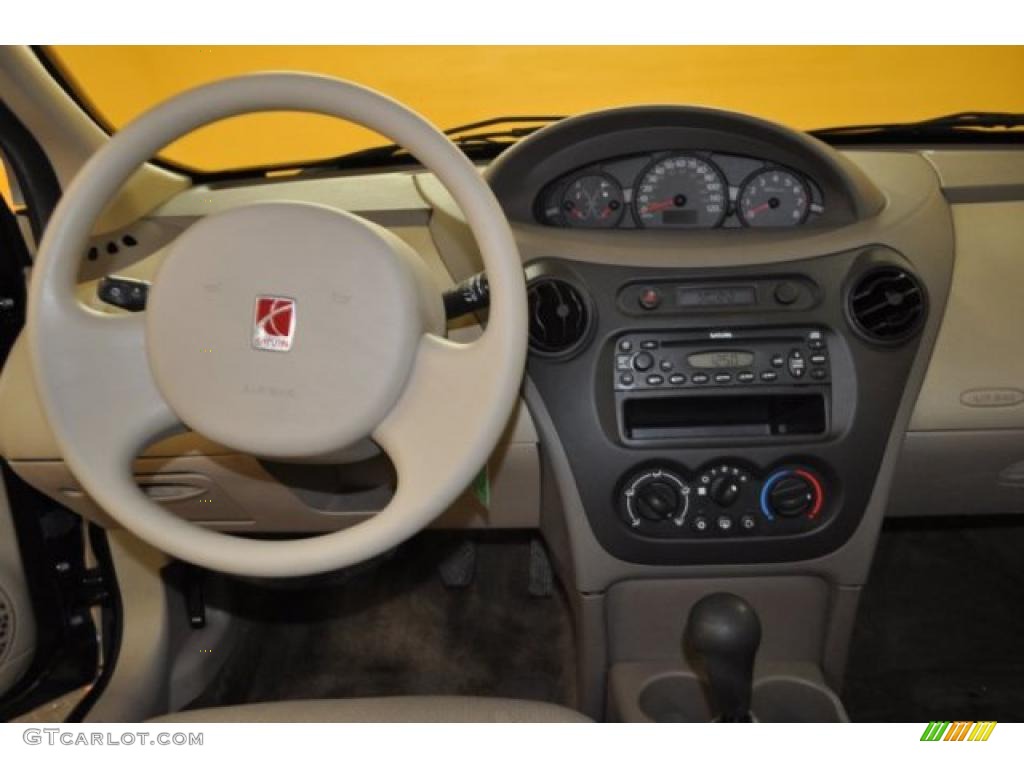 2003 Saturn ION 2 Sedan Tan Dashboard Photo #46762017