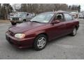 2001 Pepper Red Kia Sephia   photo #1