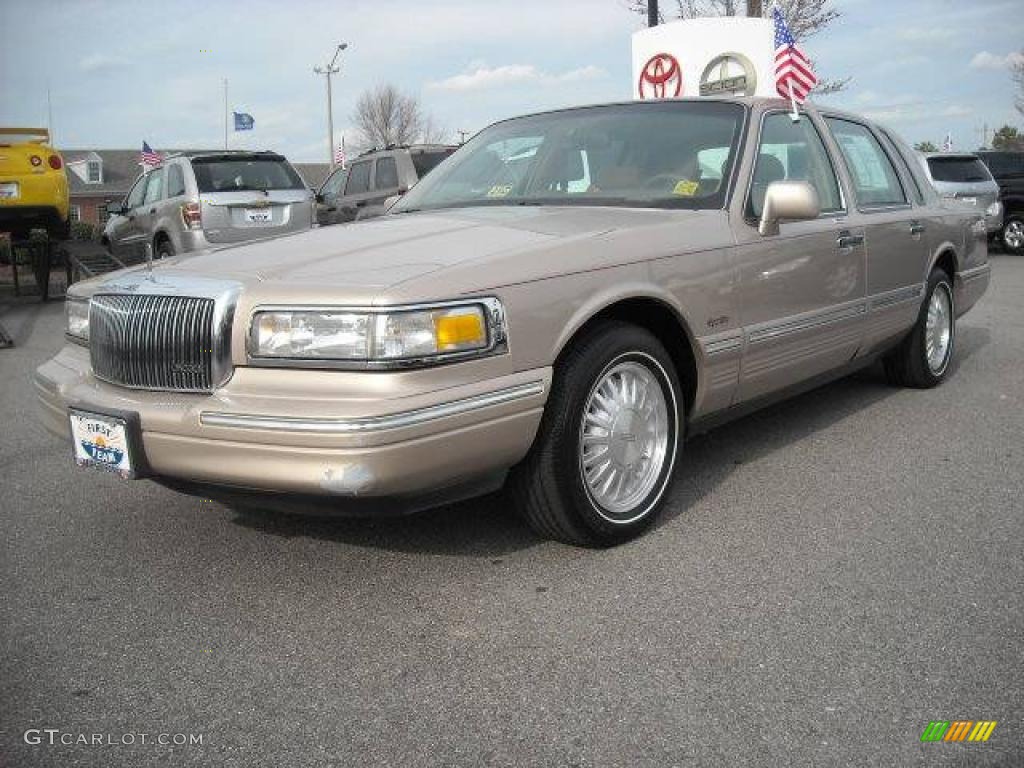 Light Prairie Tan Metallic Lincoln Town Car