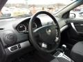 Charcoal 2011 Chevrolet Aveo LT Sedan Steering Wheel