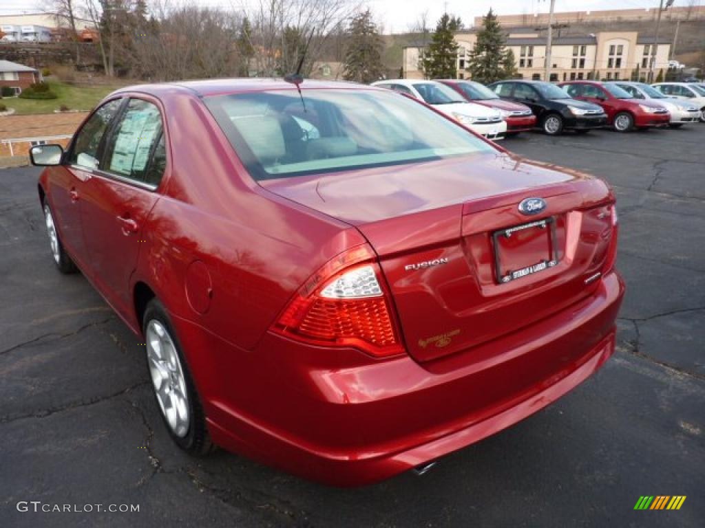 2011 Fusion SE V6 - Red Candy Metallic / Medium Light Stone photo #4