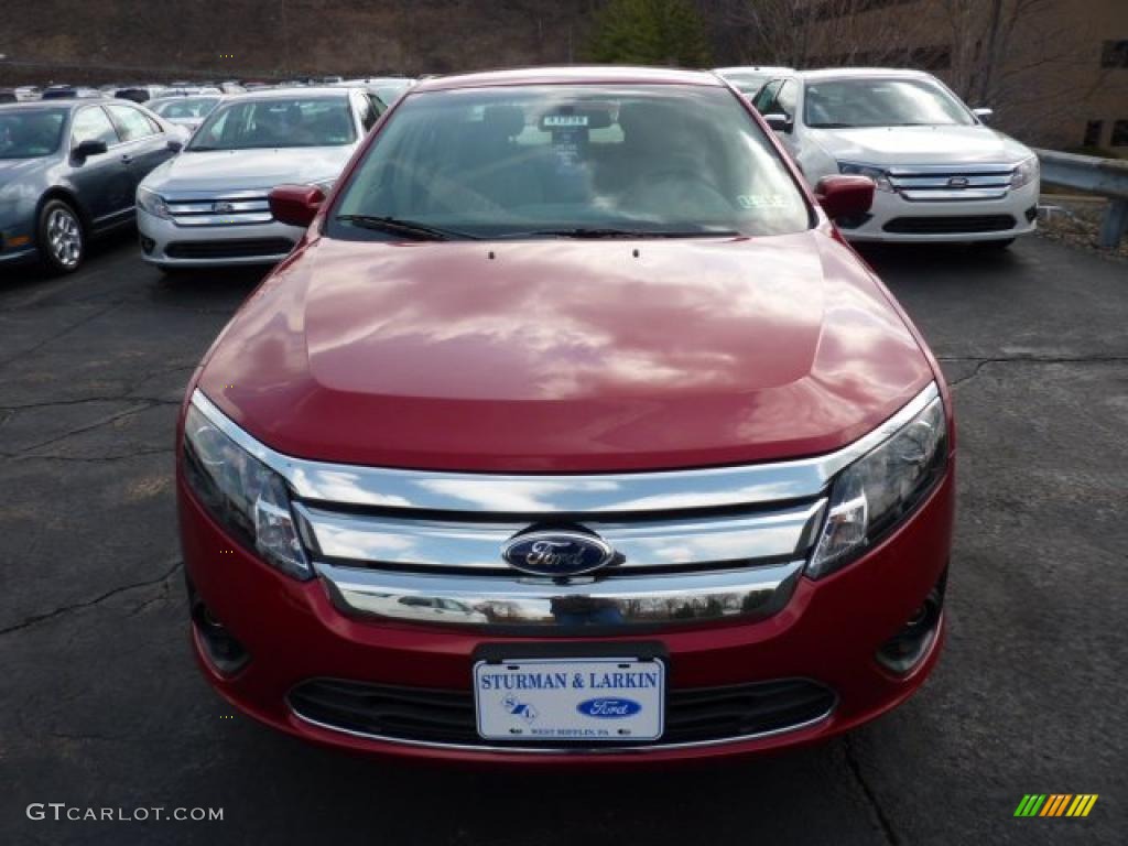 2011 Fusion SE V6 - Red Candy Metallic / Medium Light Stone photo #6