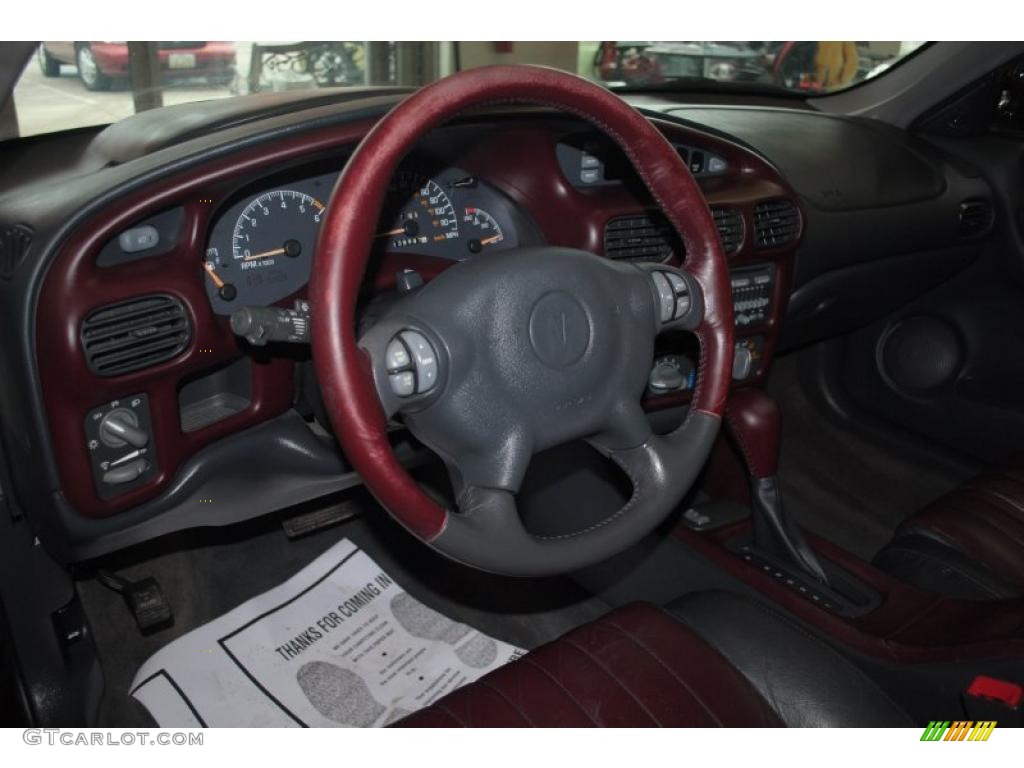 2002 Pontiac Grand Prix GT Sedan Ruby Red Steering Wheel Photo #47090603