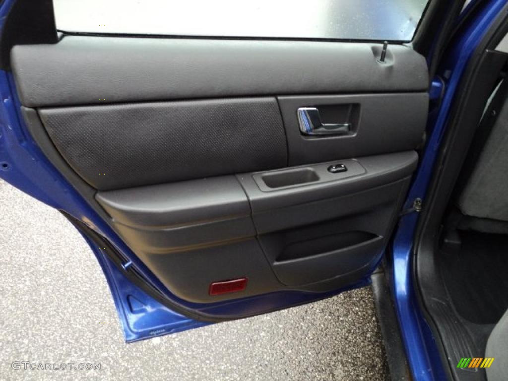 2003 Ford Taurus SE Dark Charcoal Door Panel Photo #47108303