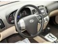 Beige 2010 Hyundai Elantra GLS Steering Wheel