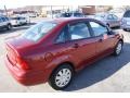 2004 Sangria Red Metallic Ford Focus SE Sedan  photo #4