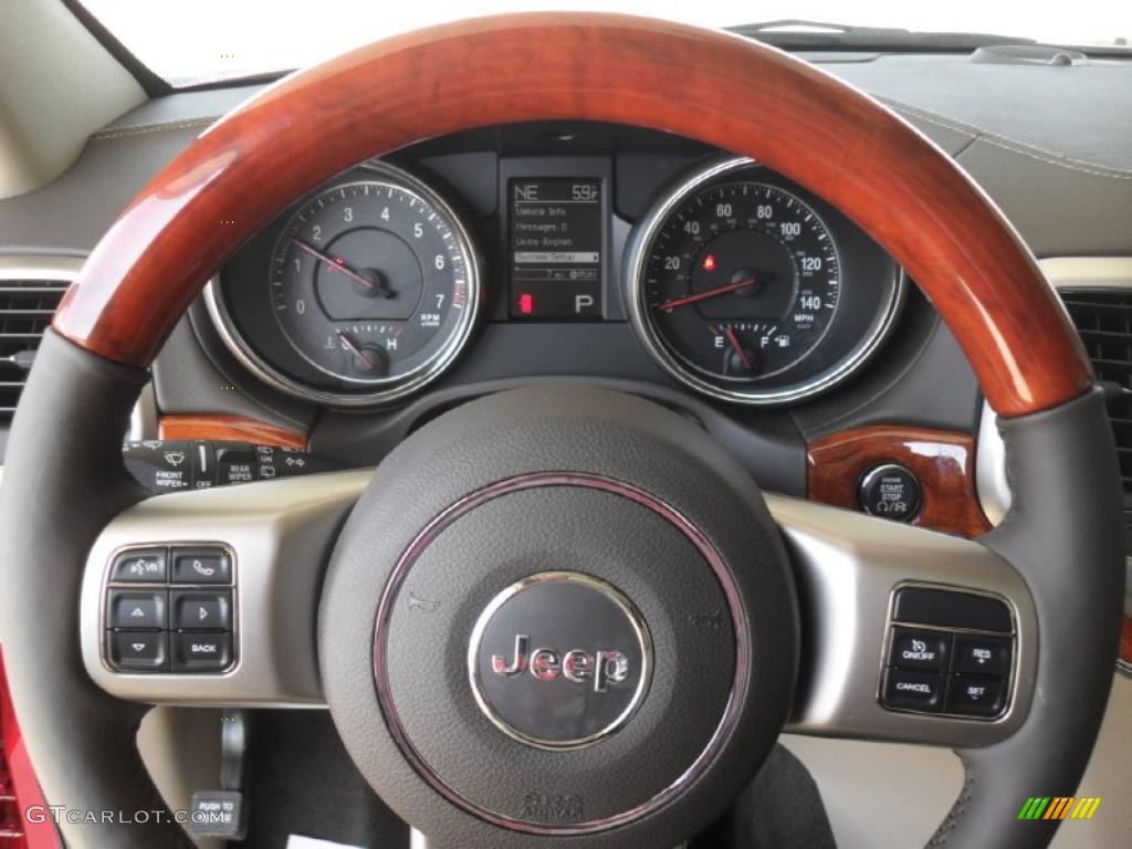 2011 Jeep Grand Cherokee Overland 4x4 Dark Frost Beige/Light Frost Beige Steering Wheel Photo #47218178