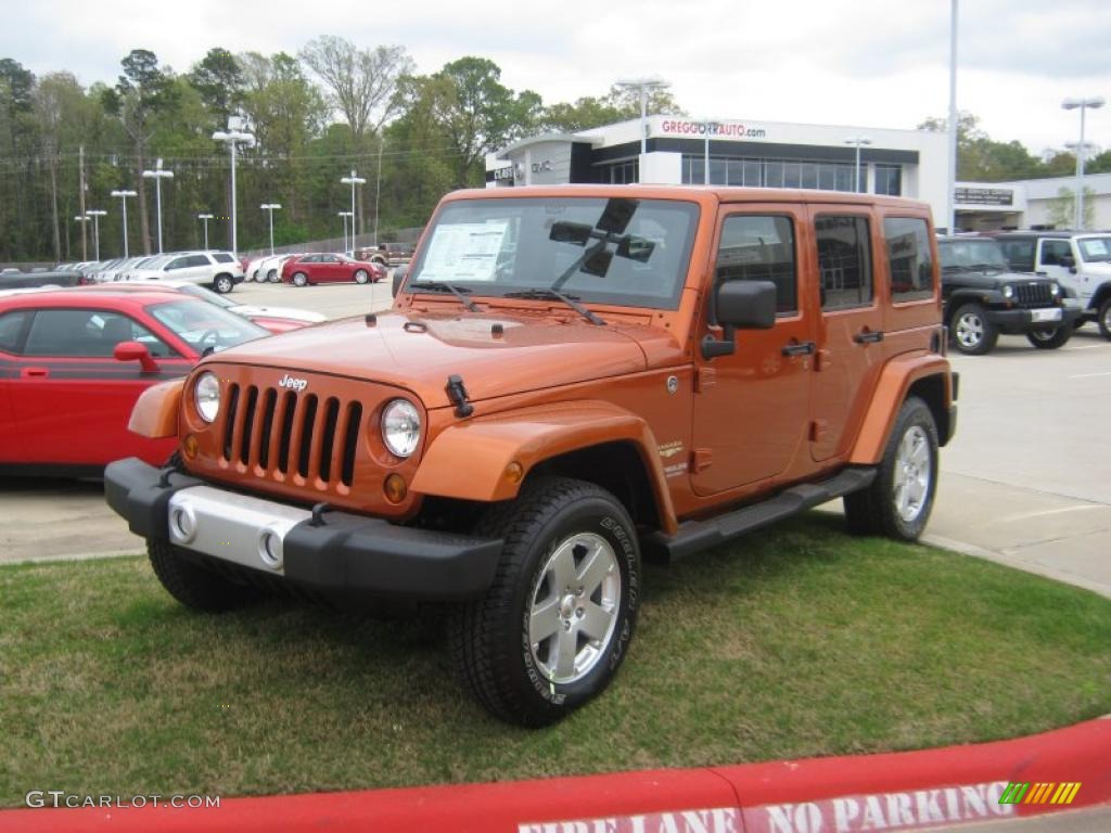 2011 Wrangler Unlimited Sahara 4x4 - Mango Tango Pearl / Black/Dark Saddle photo #1