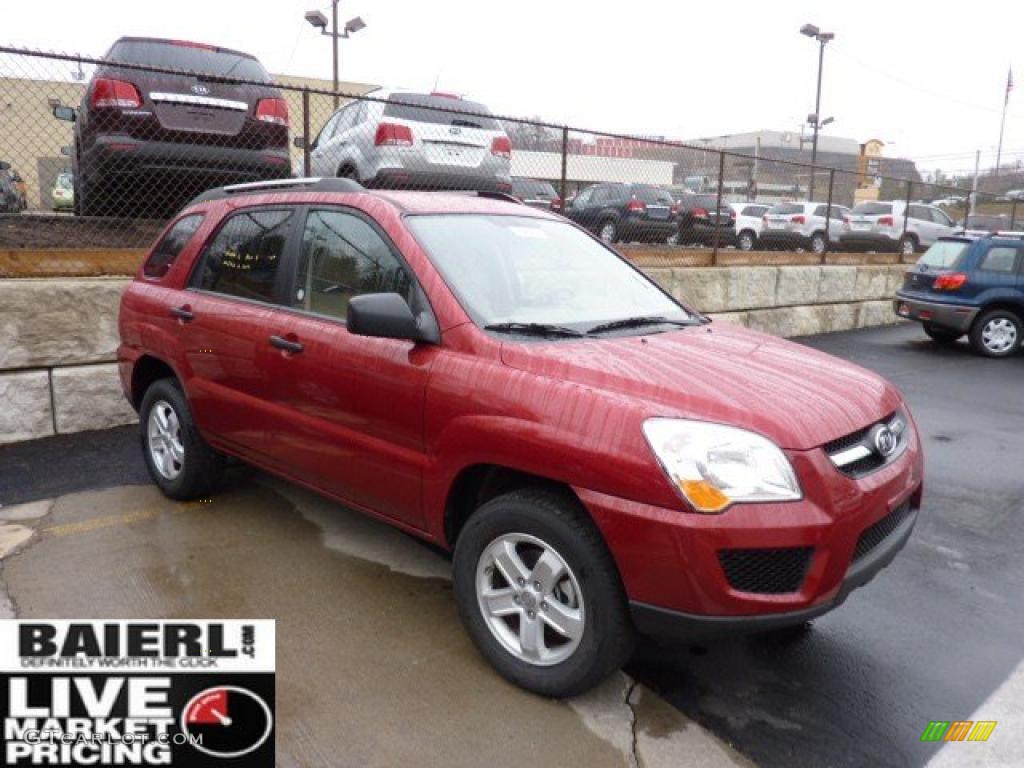 2010 Sportage LX V6 4x4 - Volcanic Red / Beige photo #1