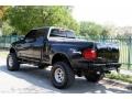 2002 Black Ford F150 XLT SuperCab 4x4  photo #7