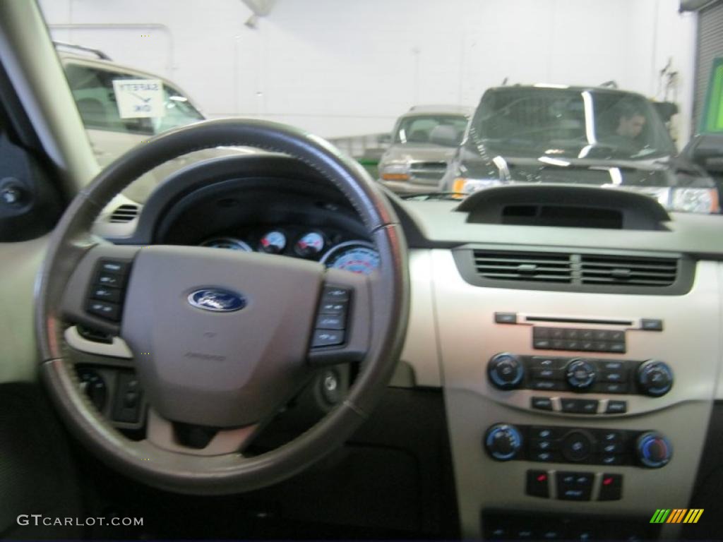 2010 Focus SEL Sedan - Ebony Black / Medium Stone photo #4