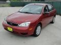 2005 Sangria Red Metallic Ford Focus ZX4 S Sedan  photo #7