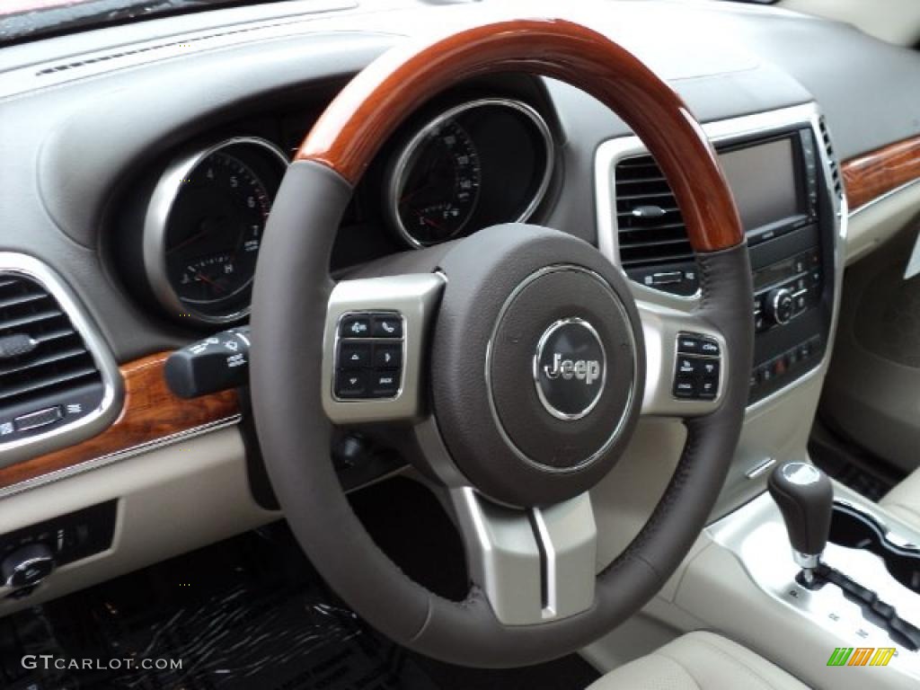 2011 Jeep Grand Cherokee Overland 4x4 Dark Frost Beige/Light Frost Beige Steering Wheel Photo #47664451