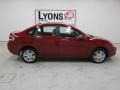 2010 Sangria Red Metallic Ford Focus SEL Sedan  photo #19