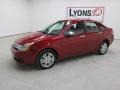 2010 Sangria Red Metallic Ford Focus SEL Sedan  photo #28