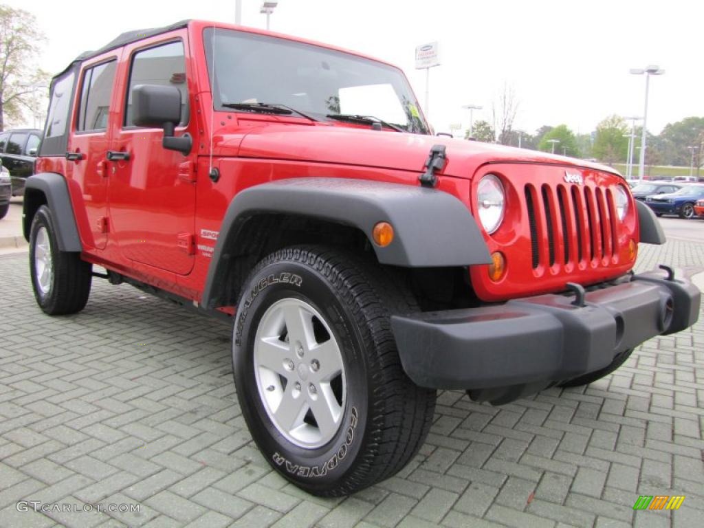 Flame Red 2010 Jeep Wrangler Unlimited Sport Exterior Photo #47842334