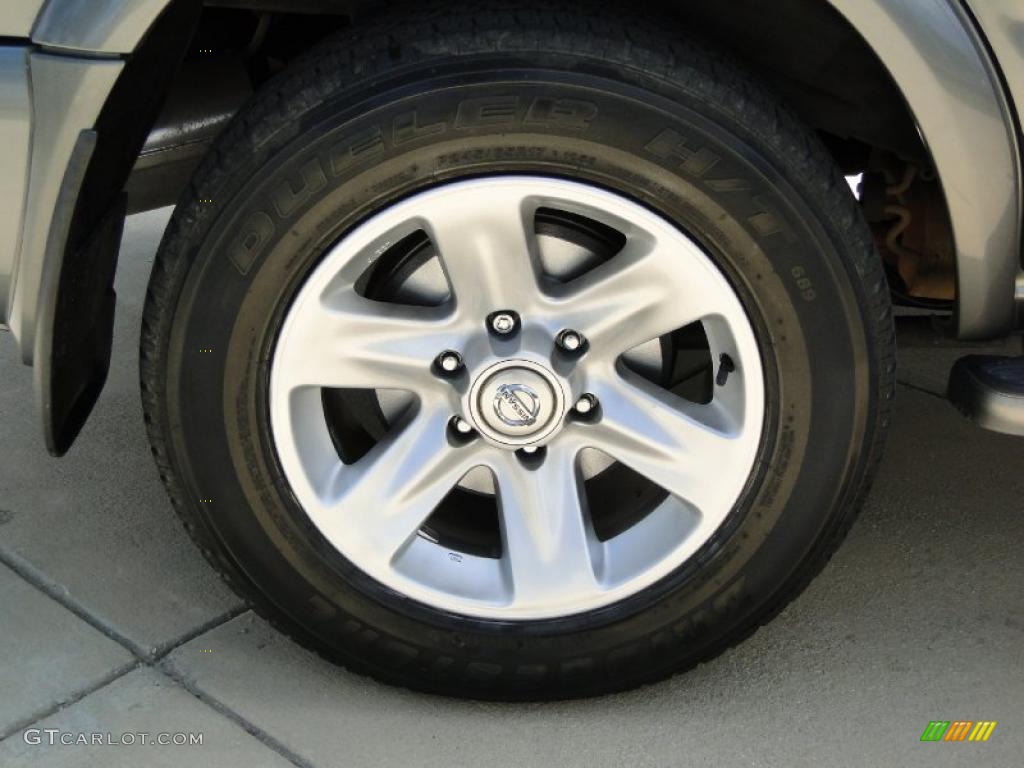 2004 Nissan Pathfinder LE Platinum Wheel Photo #47850119
