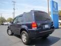 2004 True Blue Metallic Ford Escape Limited 4WD  photo #34