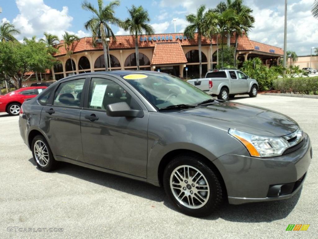 2010 Focus SE Sedan - Sterling Grey Metallic / Medium Stone photo #1