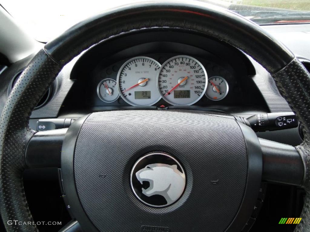 2002 Mercury Cougar V6 Coupe Midnight Black/Red Steering Wheel Photo #48232367