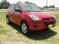 2011 Garnet Red Hyundai Tucson GL  photo #1