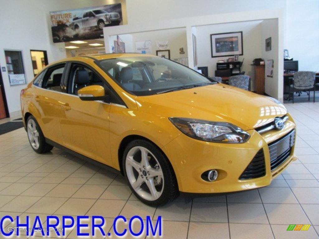 2012 Focus Titanium Sedan - Yellow Blaze Tricoat Metallic / Charcoal Black Leather photo #1