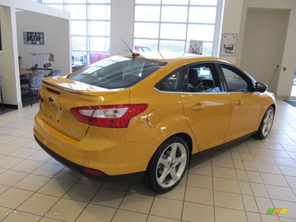 2012 Focus Titanium Sedan - Yellow Blaze Tricoat Metallic / Charcoal Black Leather photo #9