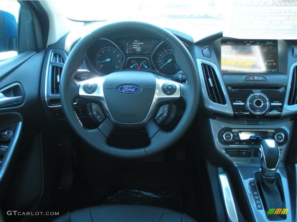 2012 Ford Focus Titanium Sedan Charcoal Black Leather Dashboard Photo #48634091
