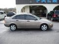 2006 Pueblo Gold Metallic Ford Focus ZX4 SE Sedan  photo #1