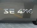2009 Nissan Frontier SE Crew Cab 4x4 Badge and Logo Photo