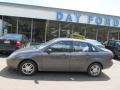 2003 Liquid Grey Metallic Ford Focus SE Sedan  photo #2