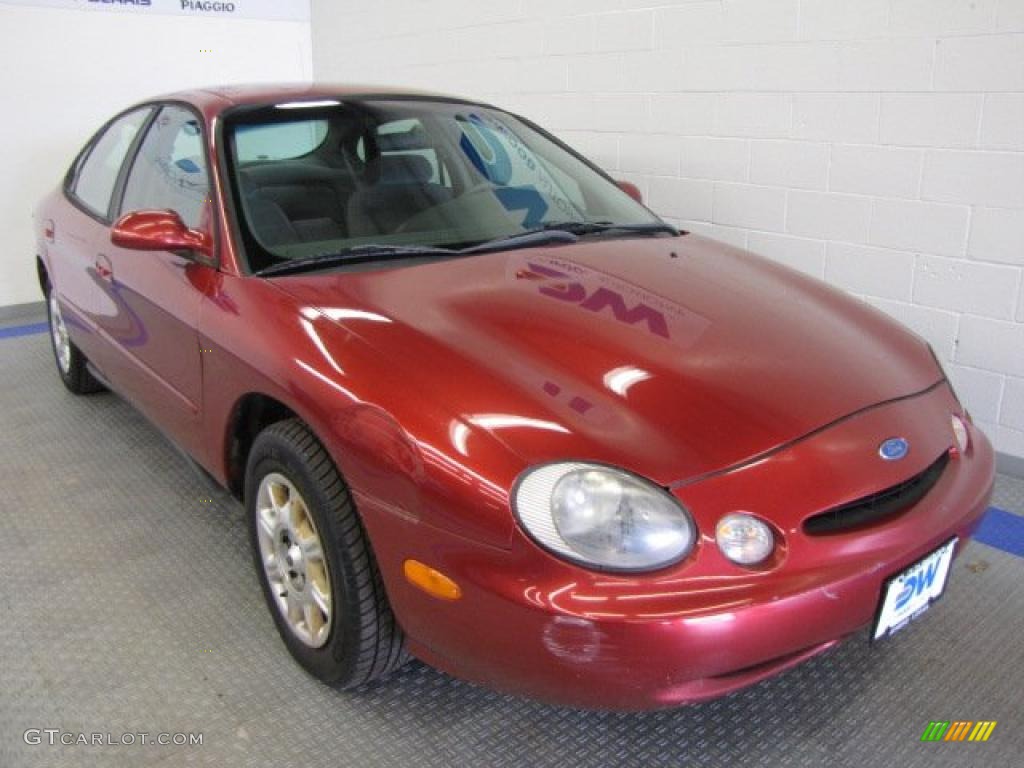 1998 Taurus SE - Toreador Red Metallic / Medium Graphite photo #1