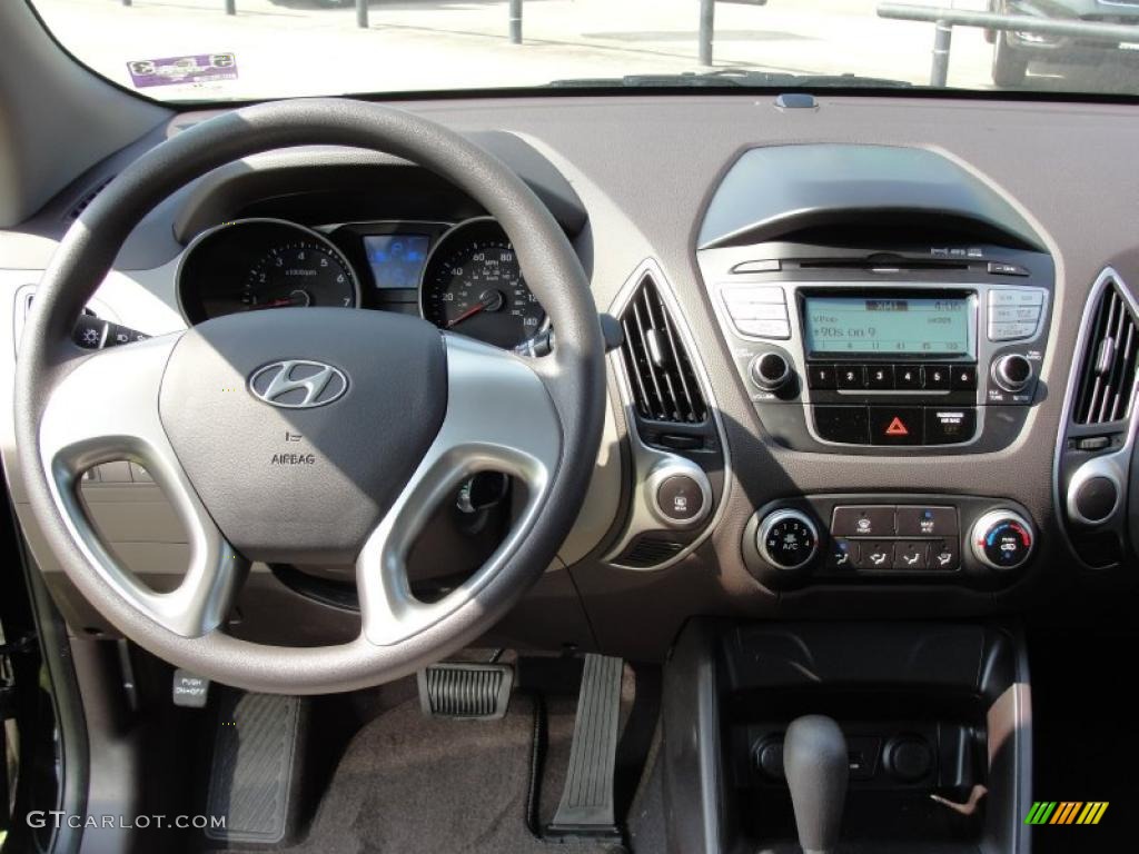 2011 Hyundai Tucson GL Taupe Dashboard Photo #49125284