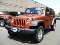 2011 Mango Tango Pearl Jeep Wrangler Unlimited Sport 4x4  photo #1