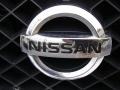 2005 Nissan Titan LE Crew Cab 4x4 Badge and Logo Photo