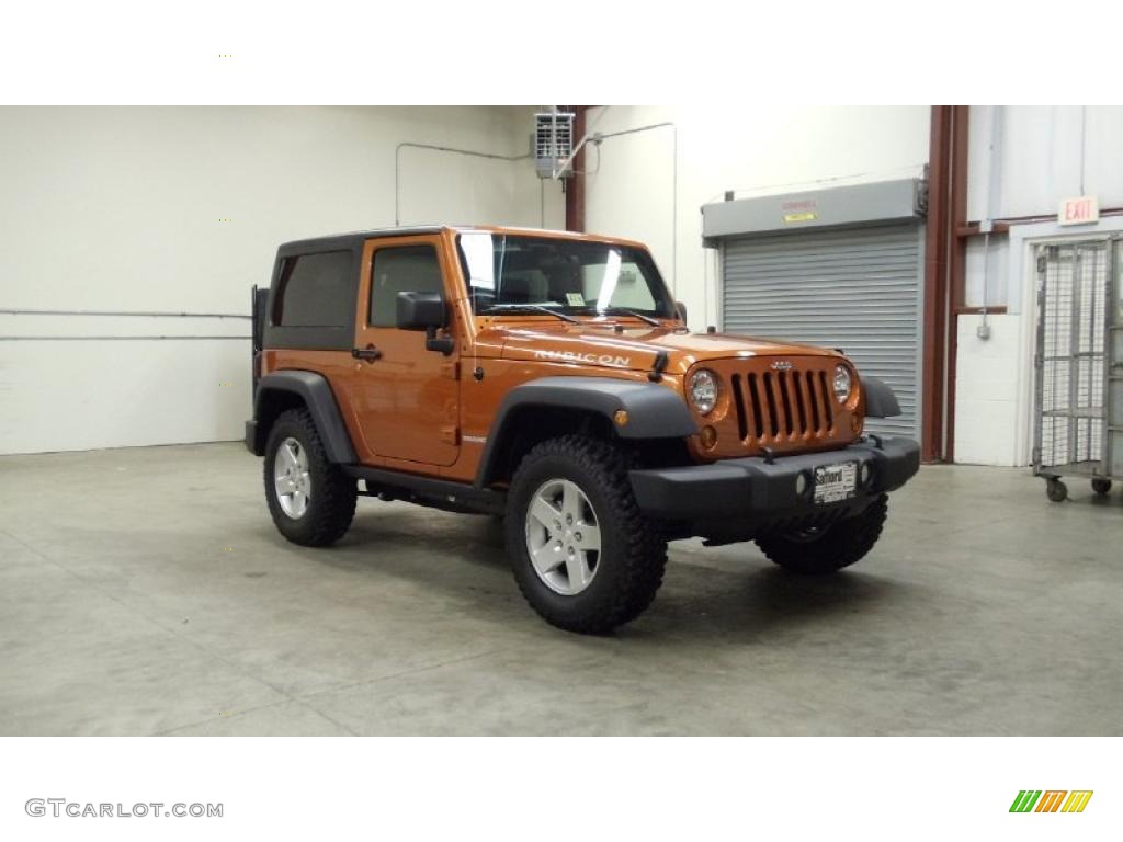 2011 Wrangler Rubicon 4x4 - Mango Tango Pearl / Black photo #3