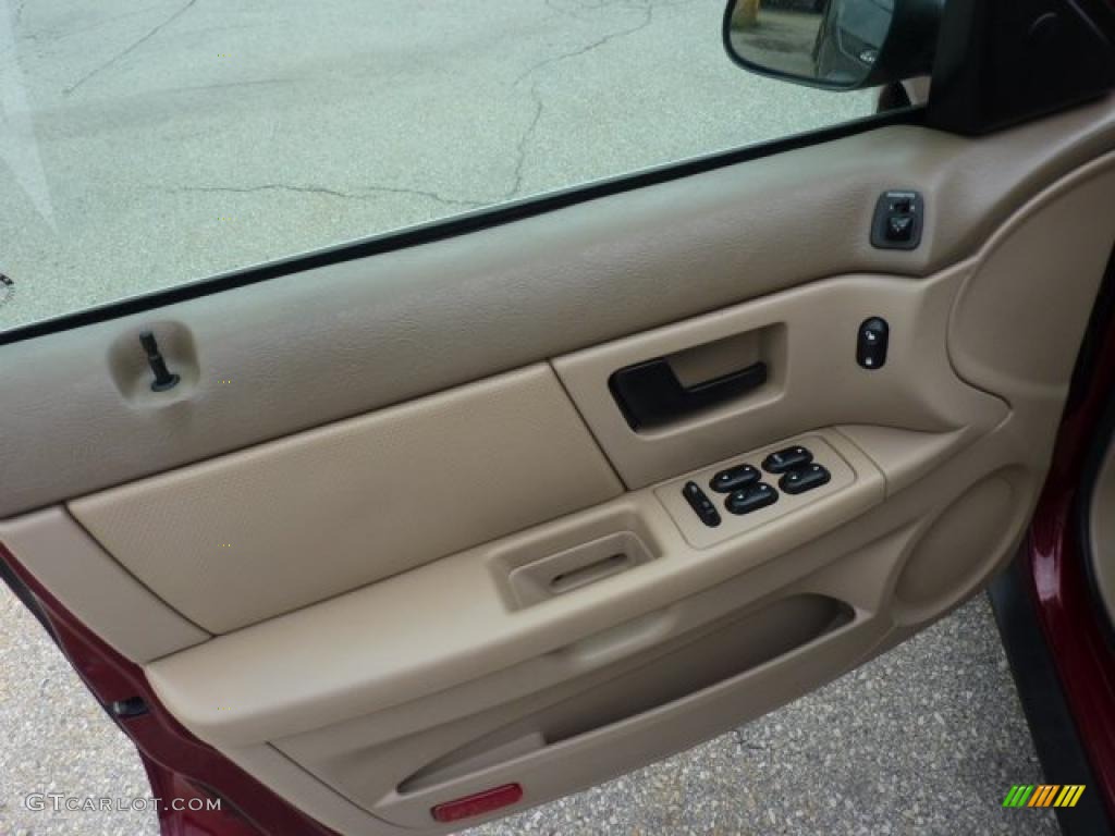 2004 Ford Taurus SE Wagon Medium Parchment Door Panel Photo #49755196